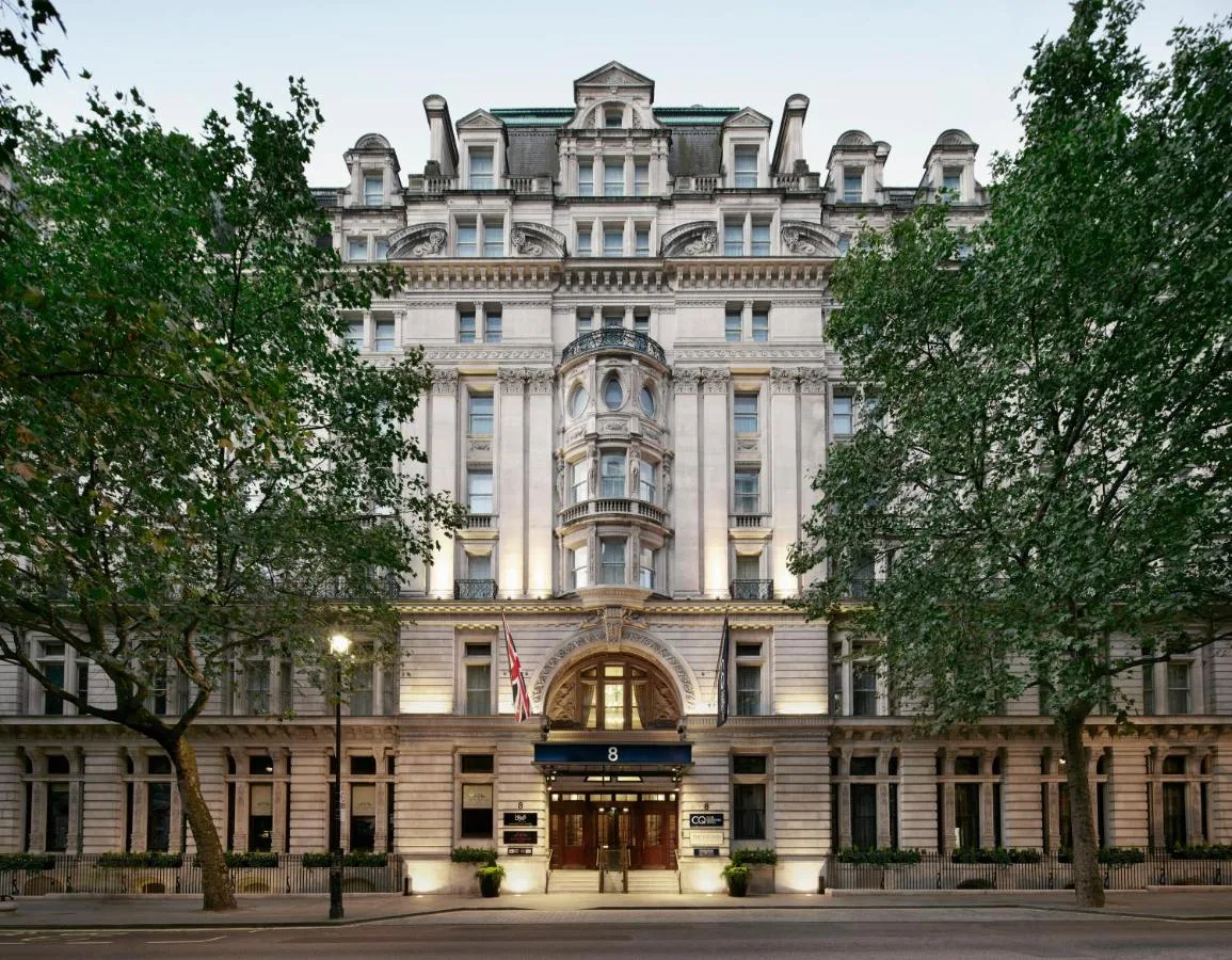 a large white building with an american flag at Club Quarters Hotel Trafalgar Square, London in London